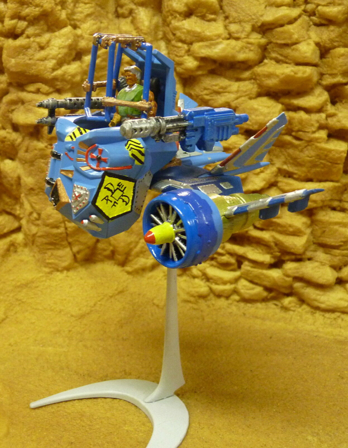 Blue and yellow robot aircraft model on a stand for Robogear 6005