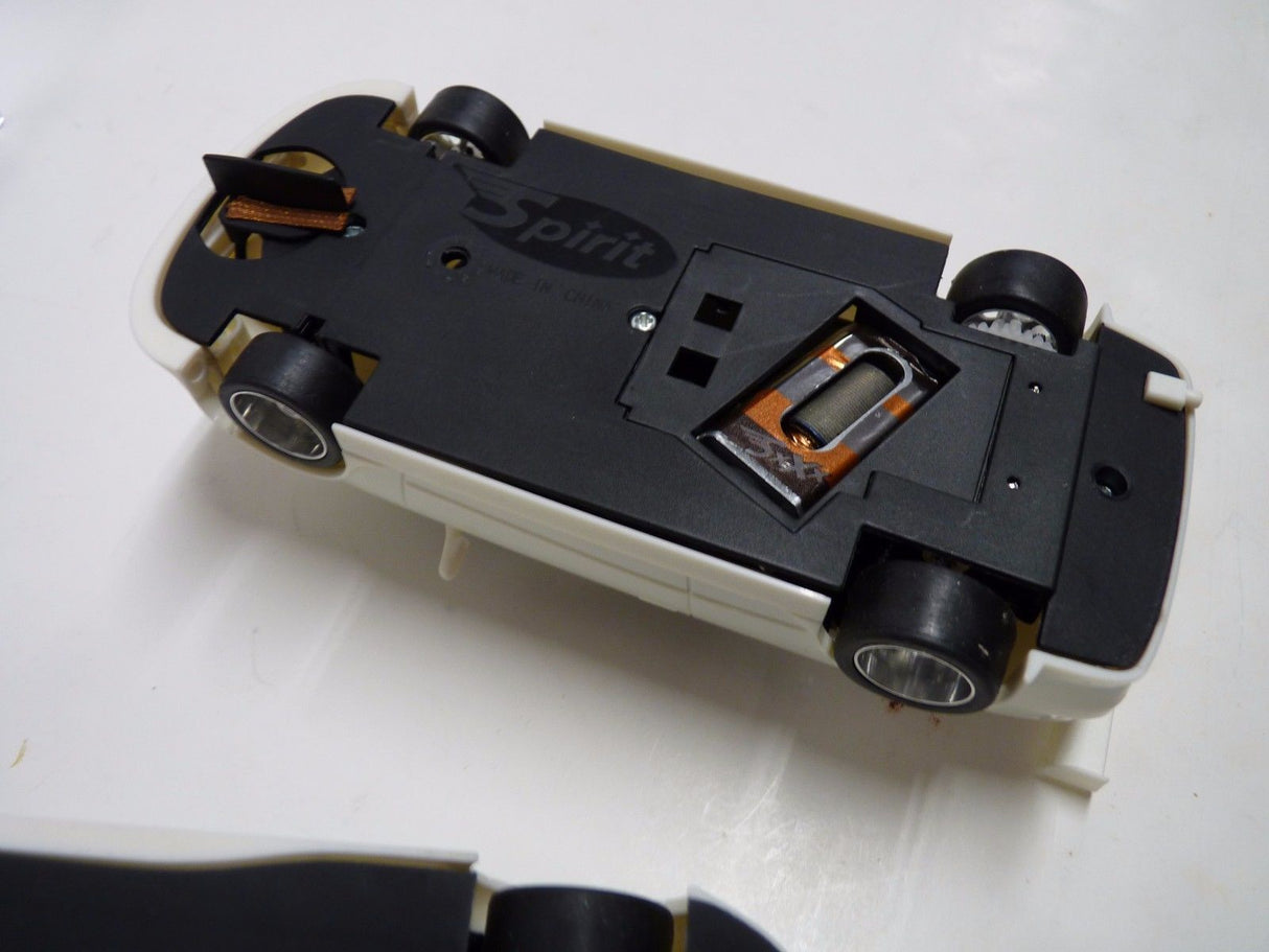 Toy car showing undercarriage details, including lights and branding for Spirit 050111