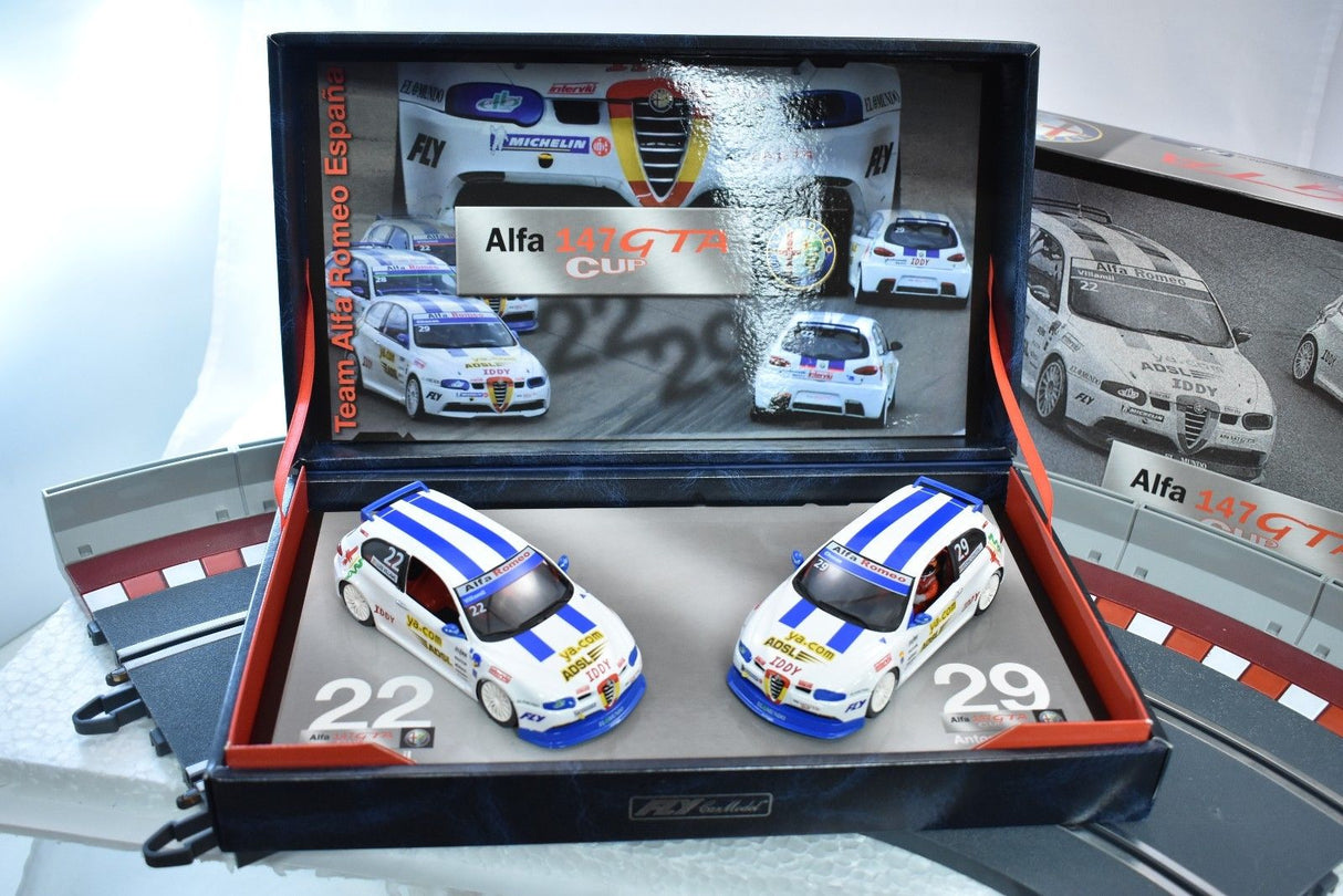 Slot cars: Alfa 147 GTA Cup models in a display case for Fly Car 96042