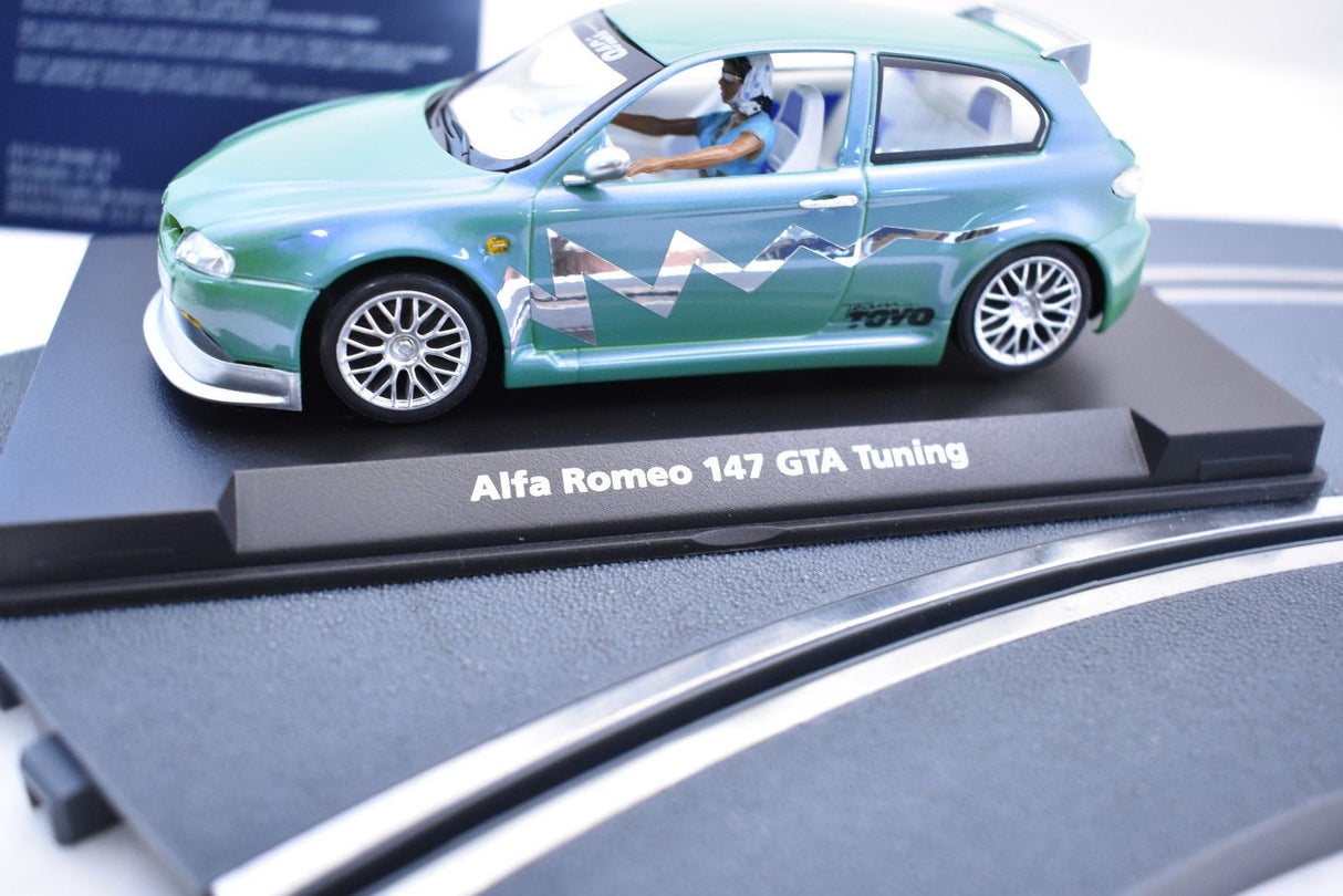 Green slot car replica of an Alfa Romeo 147 GTA Tuning model for Fly Car 07049