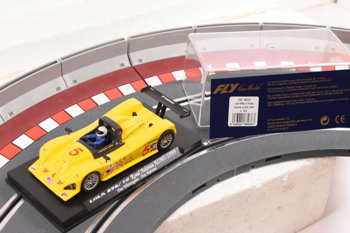 Yellow race car on a track section with product details visible for Fly Car 88038