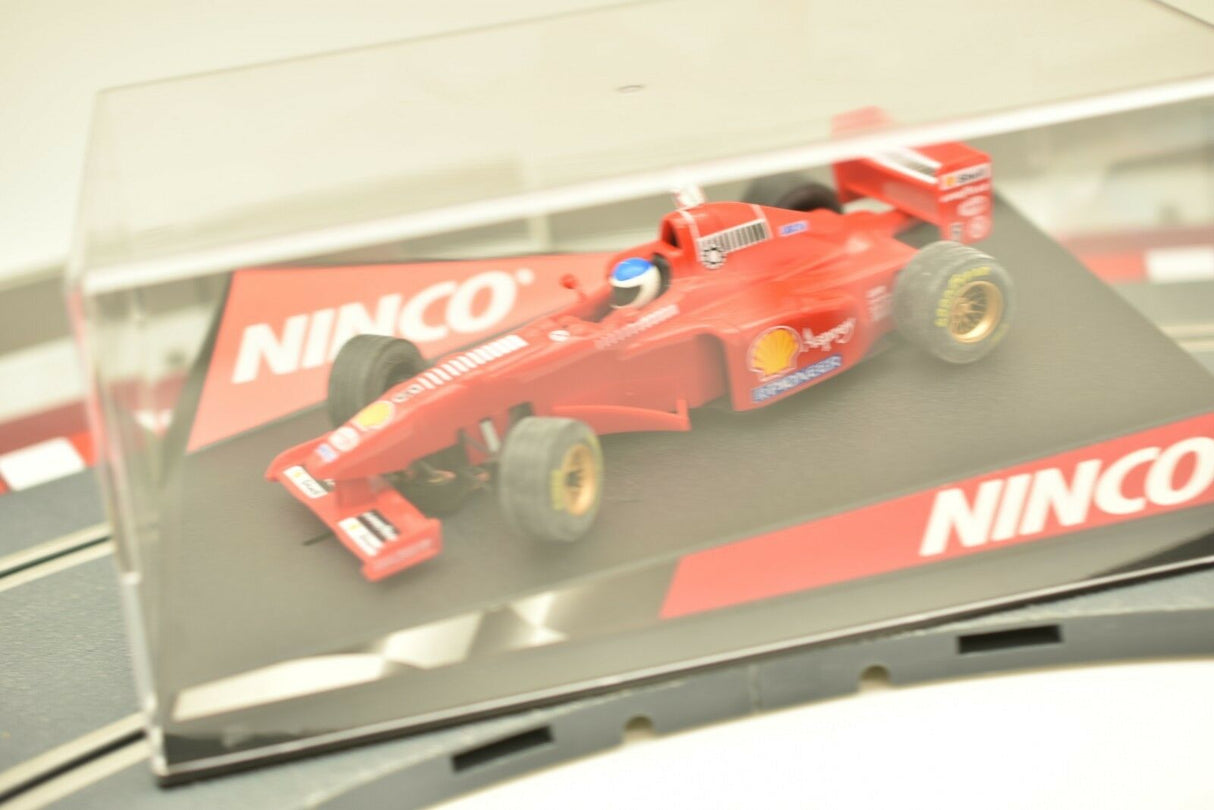 Red Ferrari slot car model on a display base for ZZ Expired Kim Collection 50162