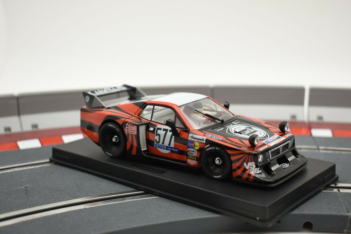Slot car of a Lancia Beta Montecarlo race car on a track section for GB Track - Fly GB38/L