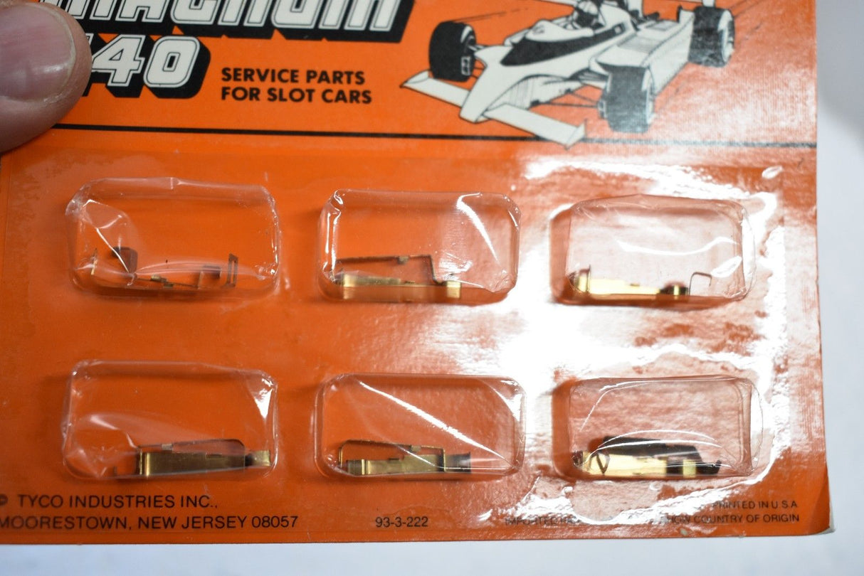Assortment of small metal parts in clear plastic packaging for slot cars for Tyco 6550