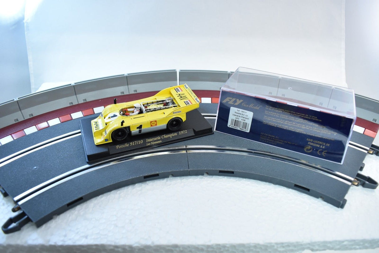 Yellow Porsche 917/10 race car model on a curved track section for Fly Car 88014