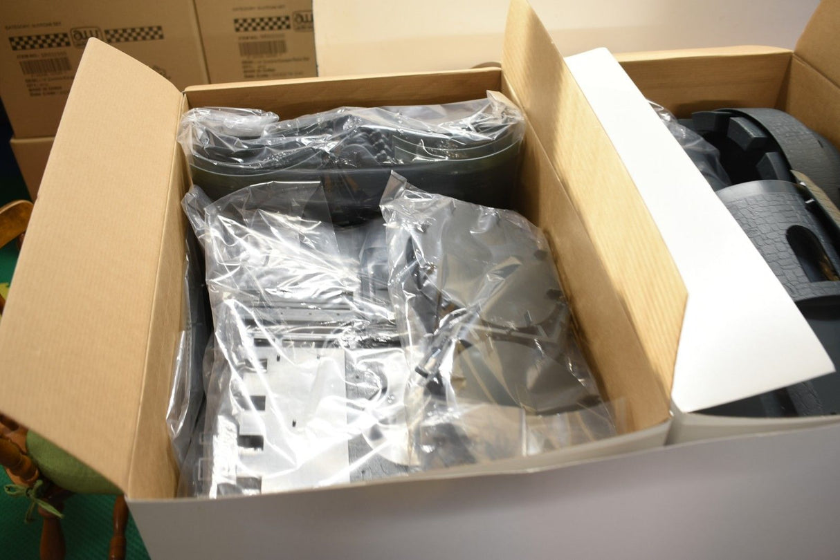 Contents of a box showing electronic components and a black accessory for IMEX IMX3282