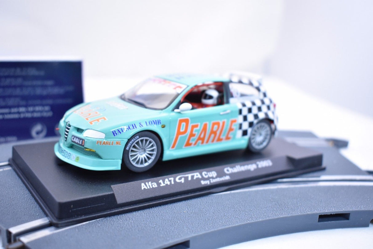 Slot car of a teal Alfa 147 GTA Cup race car on a display base for Fly Car 88112, rear view