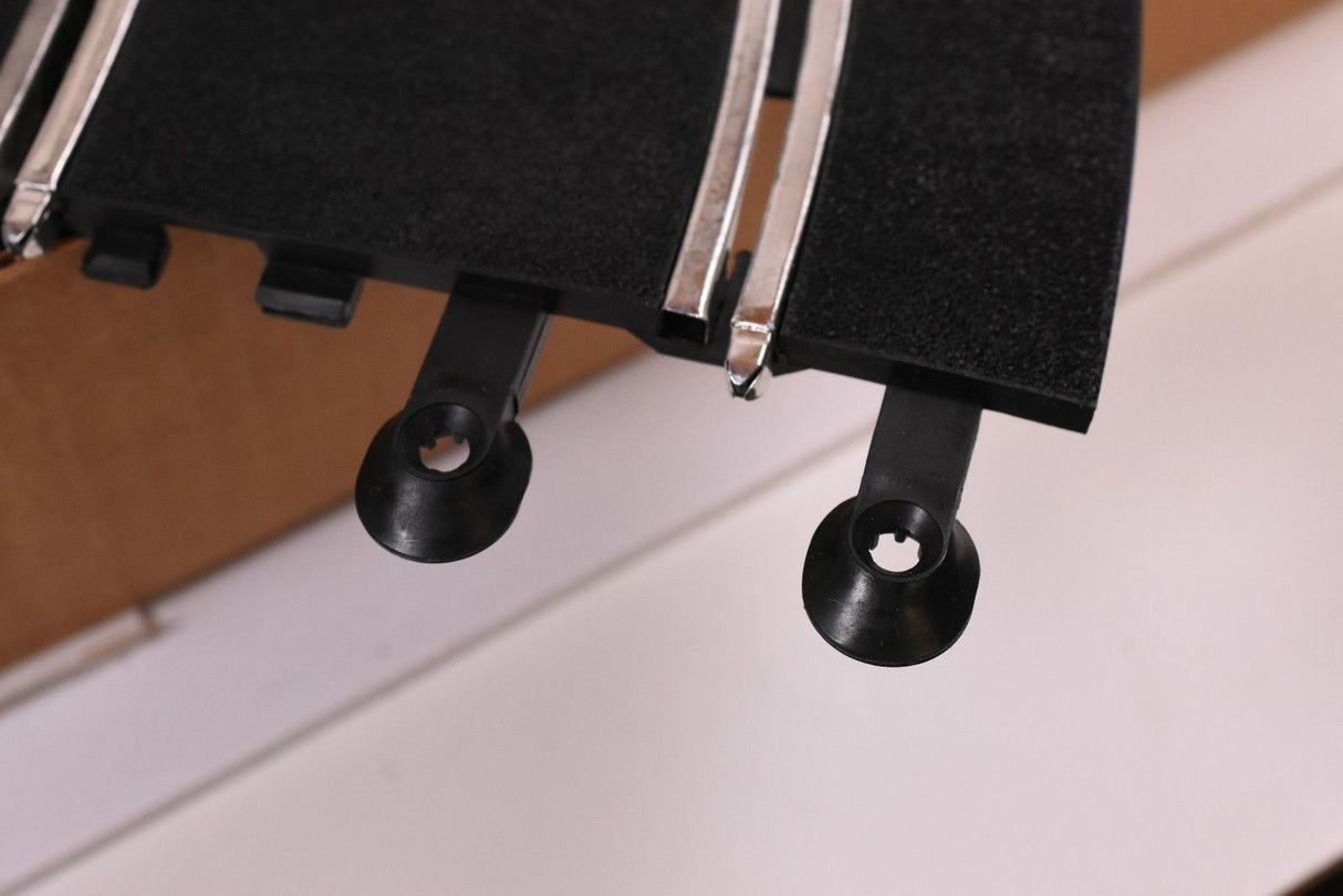 Black track section with two mounting points for race setup for SCX/Scalextric SPA300