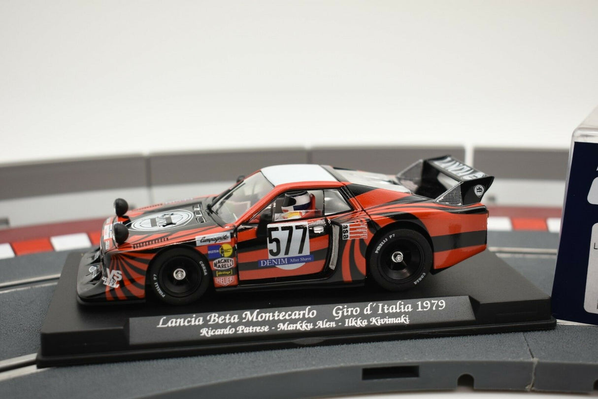 Red and black Lancia Beta Montecarlo race car model on a track base for GB Track - Fly GB38/L
