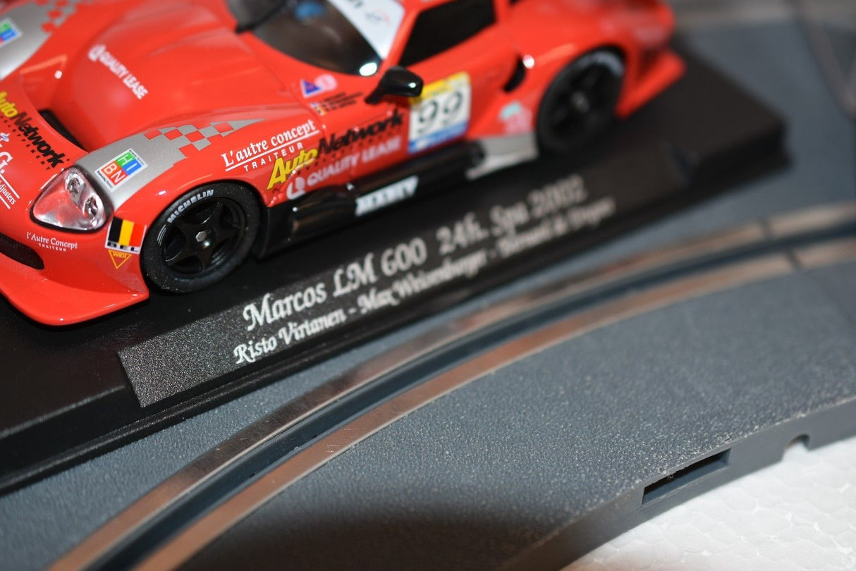 Red race car model, Marcos LM 600, displayed on a plaque for Fly Car 88037