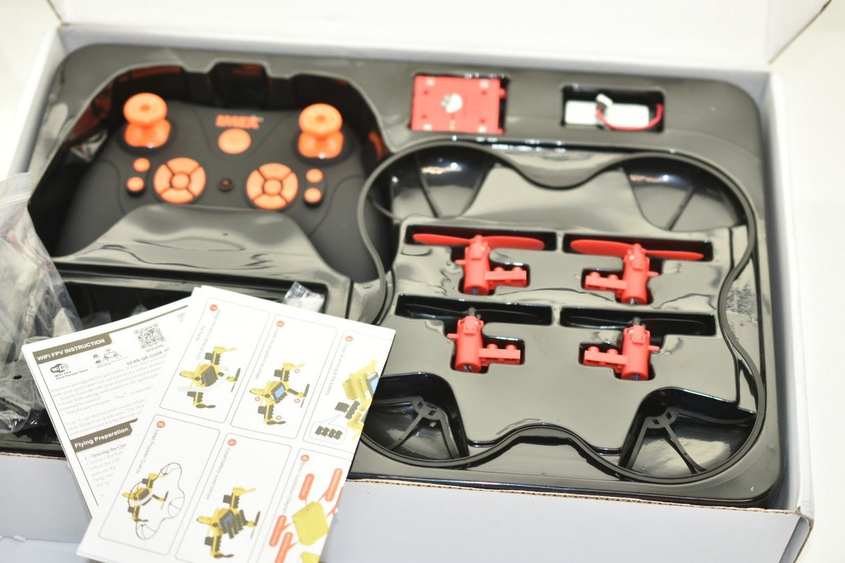 Drone kit components laid out in an open box with instructions for IMEX 88805