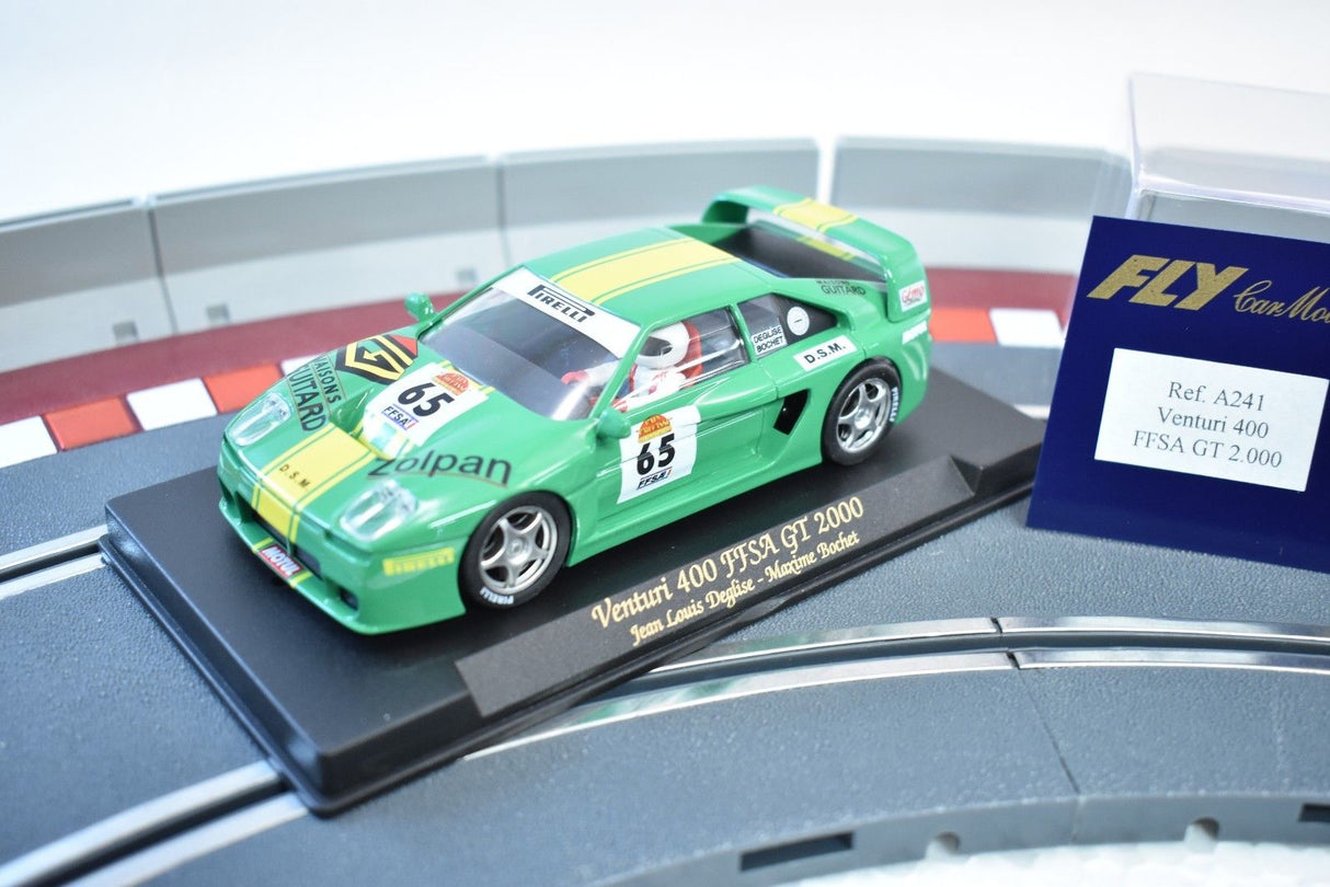 Green race car model on a track section with product details for REH Fly A241