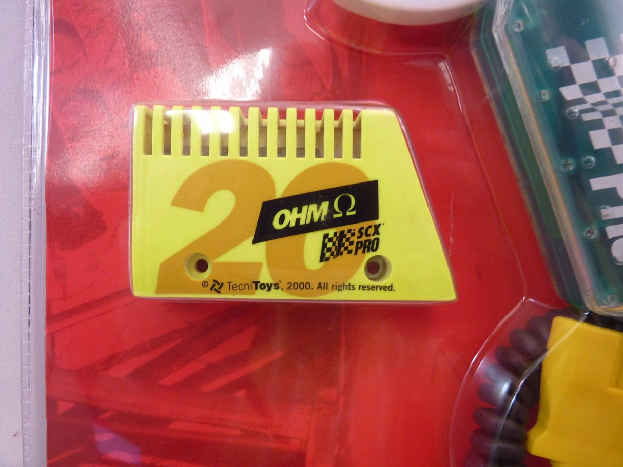 Yellow resistor labeled "OHM $\Omega$ SCX PRO" on a red background for 50180