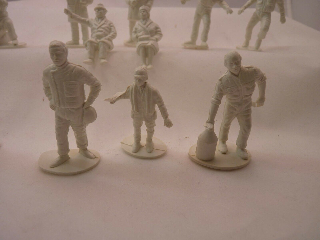 Unpainted plastic figures of motor racing track officials and spectators for AIRFIX