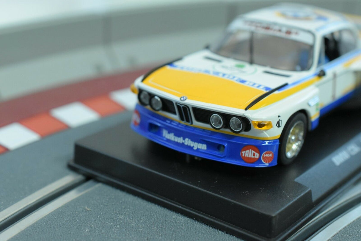 Yellow and white BMW race car model on a track section for Fly Car 88177, track view