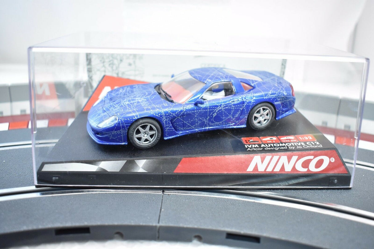 Blue slot car on display card for Ninco 50248