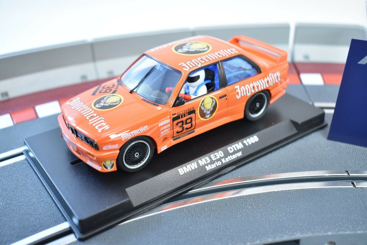 Orange slot car of a 1988 BMW M3 E30 race car for Fly Car 88217