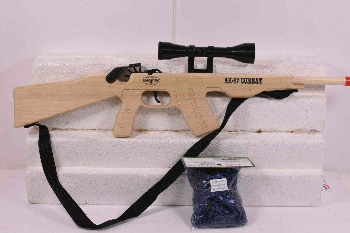 Toy rifle with scope, sling, and blue ammo on a white surface for Magnum Rubber Band Guns GL2AK47CSS