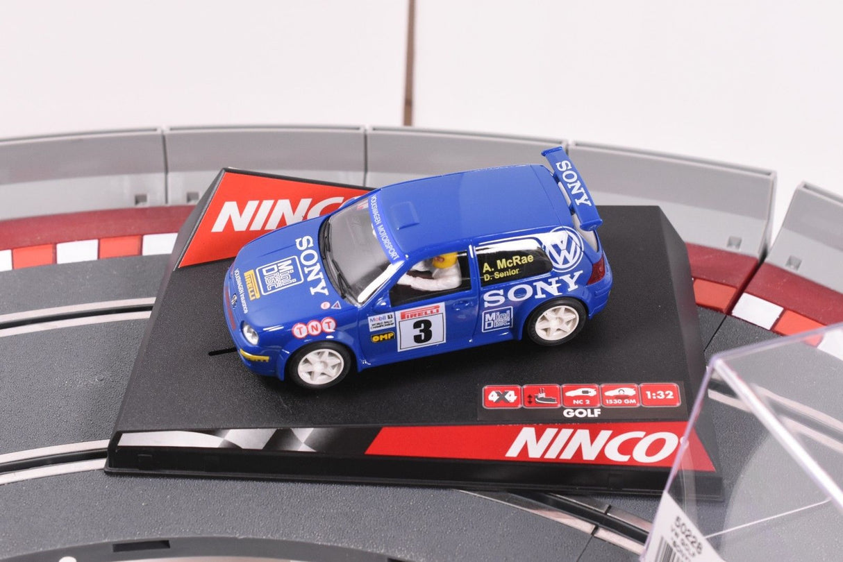 Blue VW Golf toy car with "Sony" branding on a track base for Ninco 50228, alternate track view