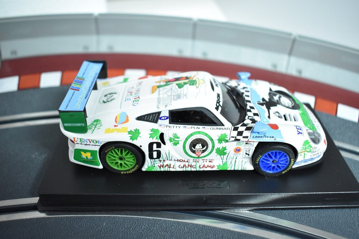 Slot car of a white and green Porsche 911 GT1 Evo race car for Fly Car 88222