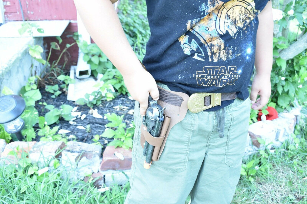 Boy holding a toy revolver in a holster attached to his pants for Parris Toys 4603C