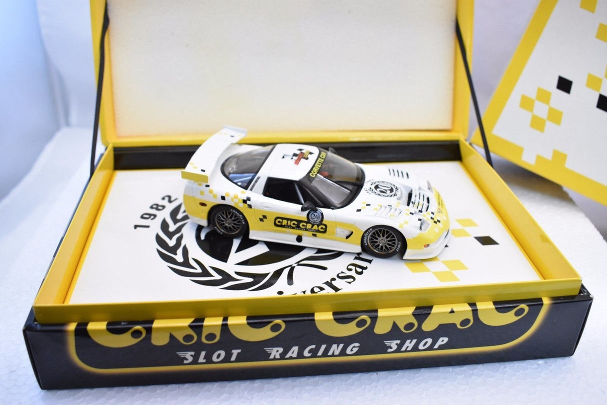 Yellow slot car Corvette model in open box with logo for Fly Car E123