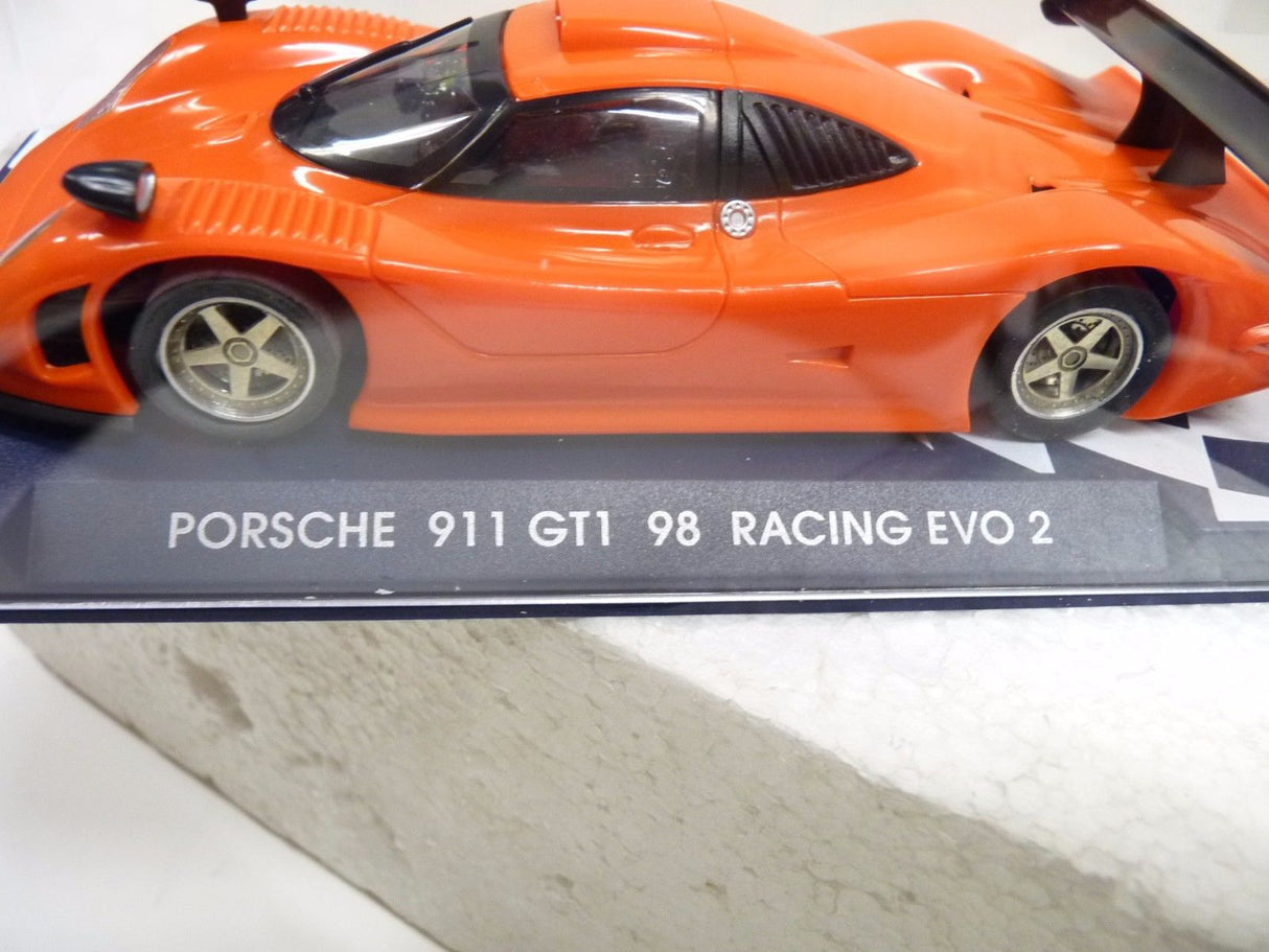 Orange slot car of a Porsche 911 GT1 98 Racing EVO 2 for Fly Car 07002, rear view