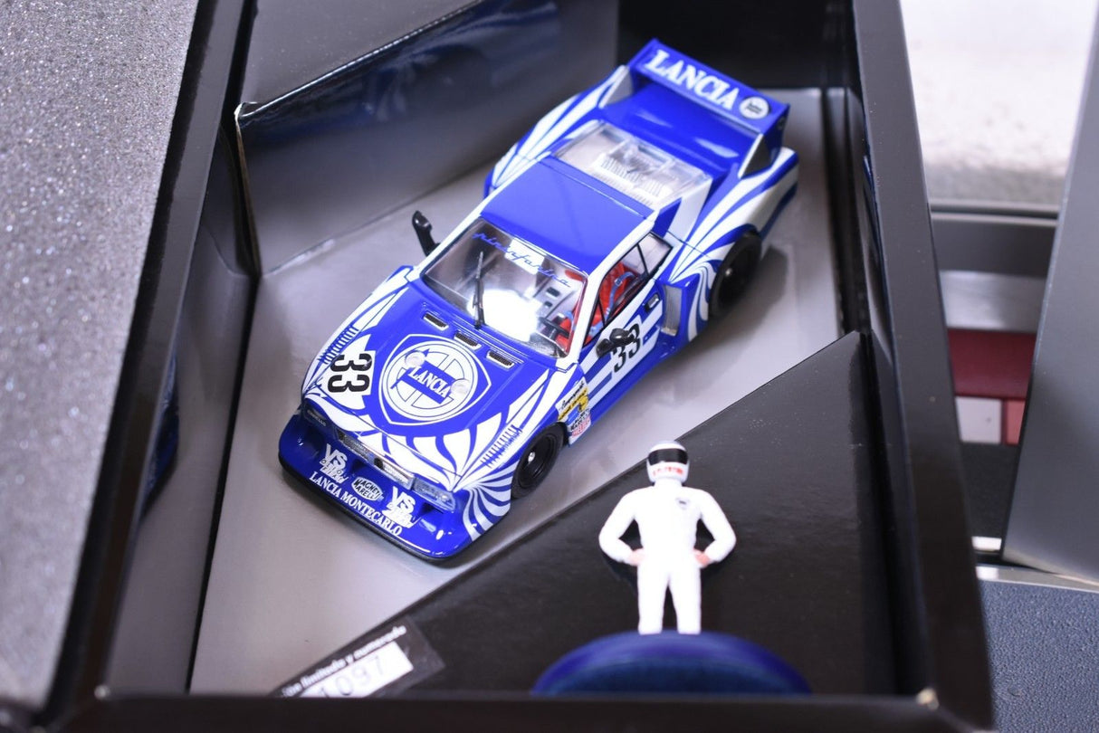 Blue Lancia Montecarlo model car with small figure in display case for Fly Car 96011
