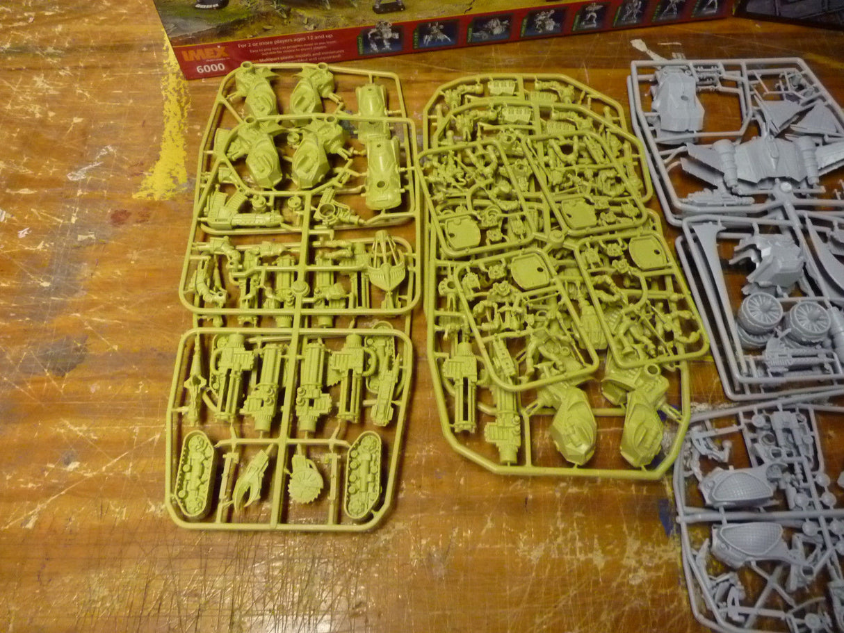 Green and gray plastic miniature bases for tabletop wargaming for IMEX 6000