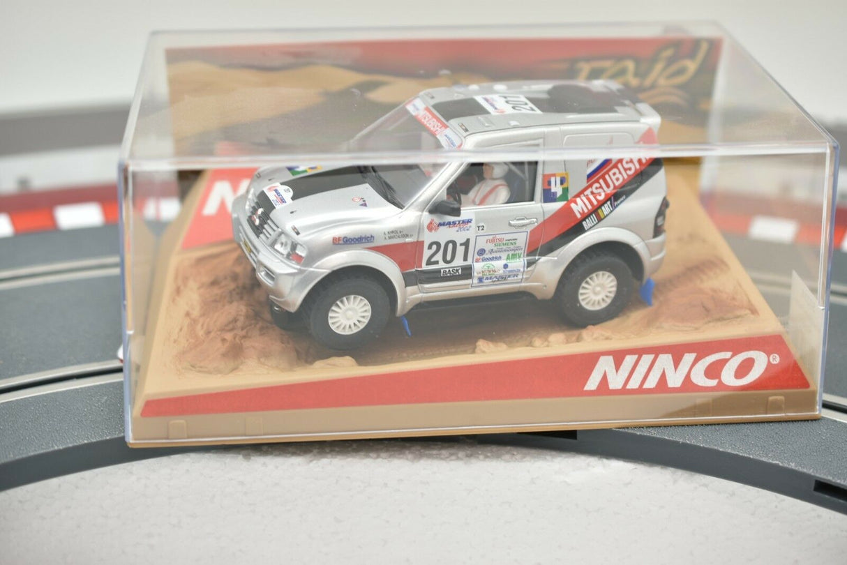 Silver Mitsubishi Pajero race car model in clear display box for Ninco 50314