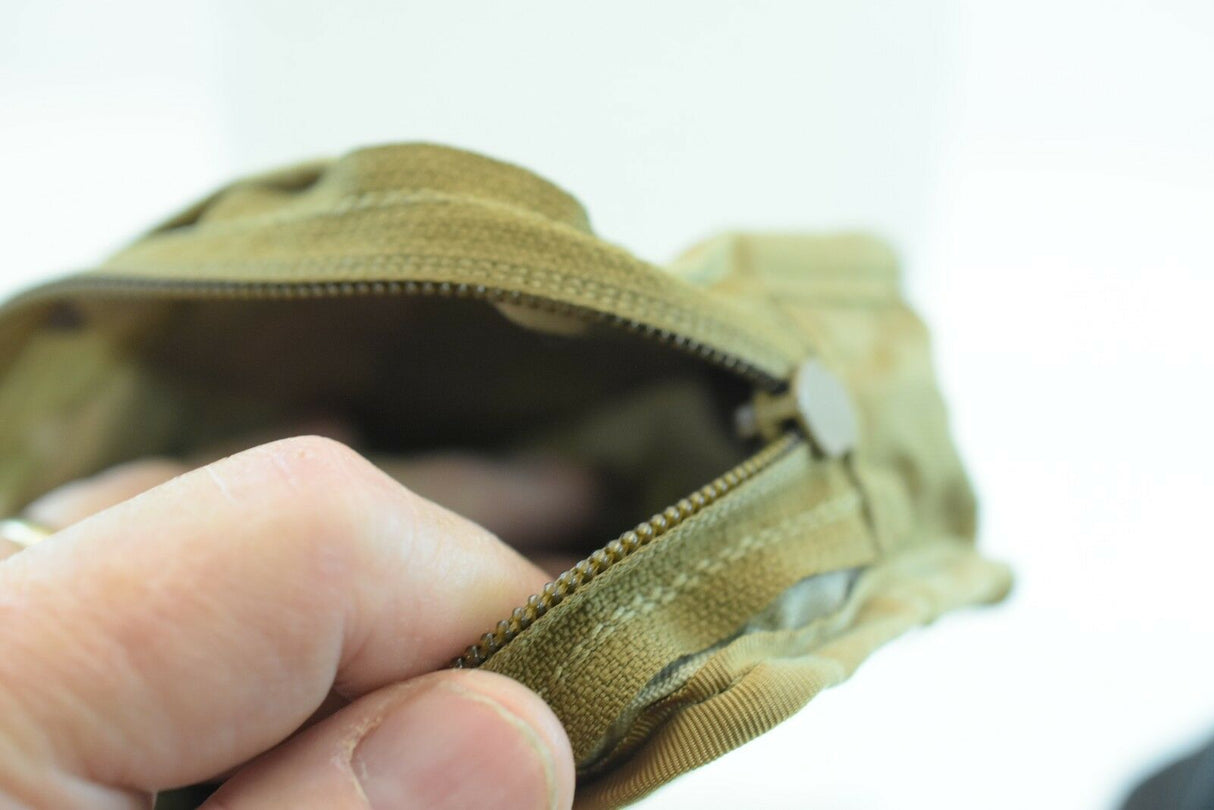 Open khaki wallet showing interior zipper and material texture for While The Cigars Lit WTCL001