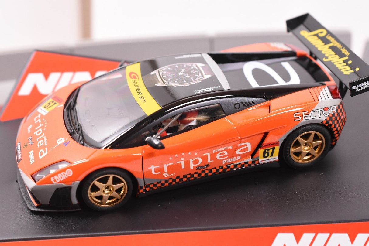 Orange Lamborghini Gallardo slot car model on a black surface for ZZ Expired Kim Collection 50513