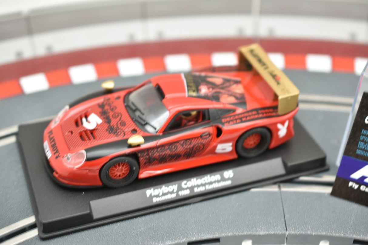 Red slot car on a track base, part of the Playboy Collection for Fly Car 99049