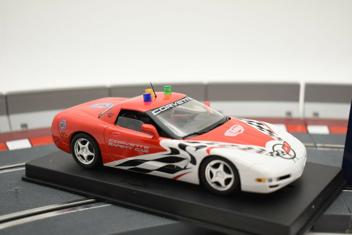 Red and white Corvette race car model on a track section for Fly Car 99006, alternate track view
