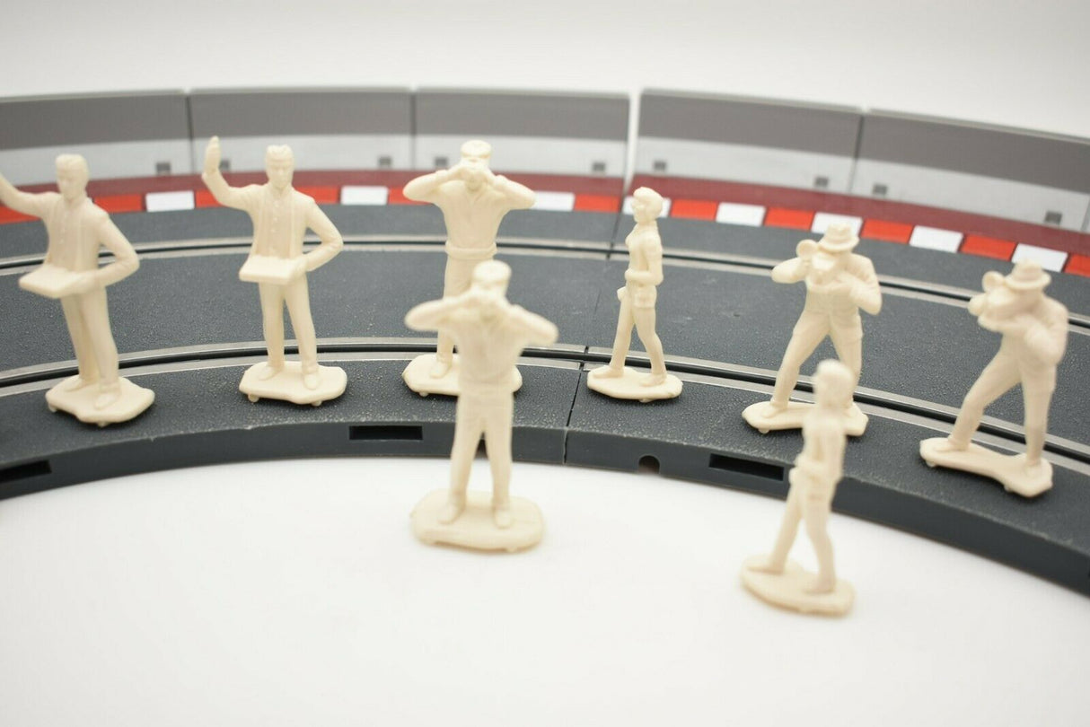 Unpainted 1/32 scale figures of motor racing spectators standing on a track section for HORNBY 303058821440