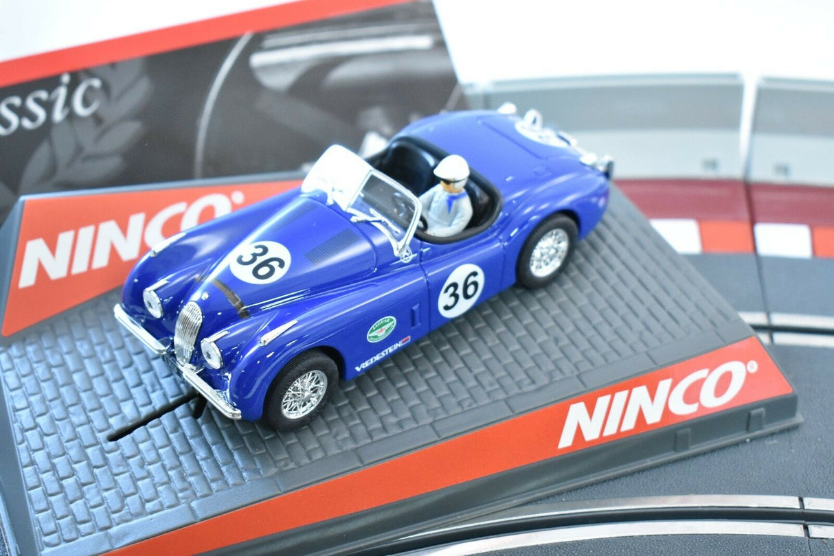 Blue 1/32 scale race car with driver, displayed on a branded base for ZZ Expired Kim Collection 50520