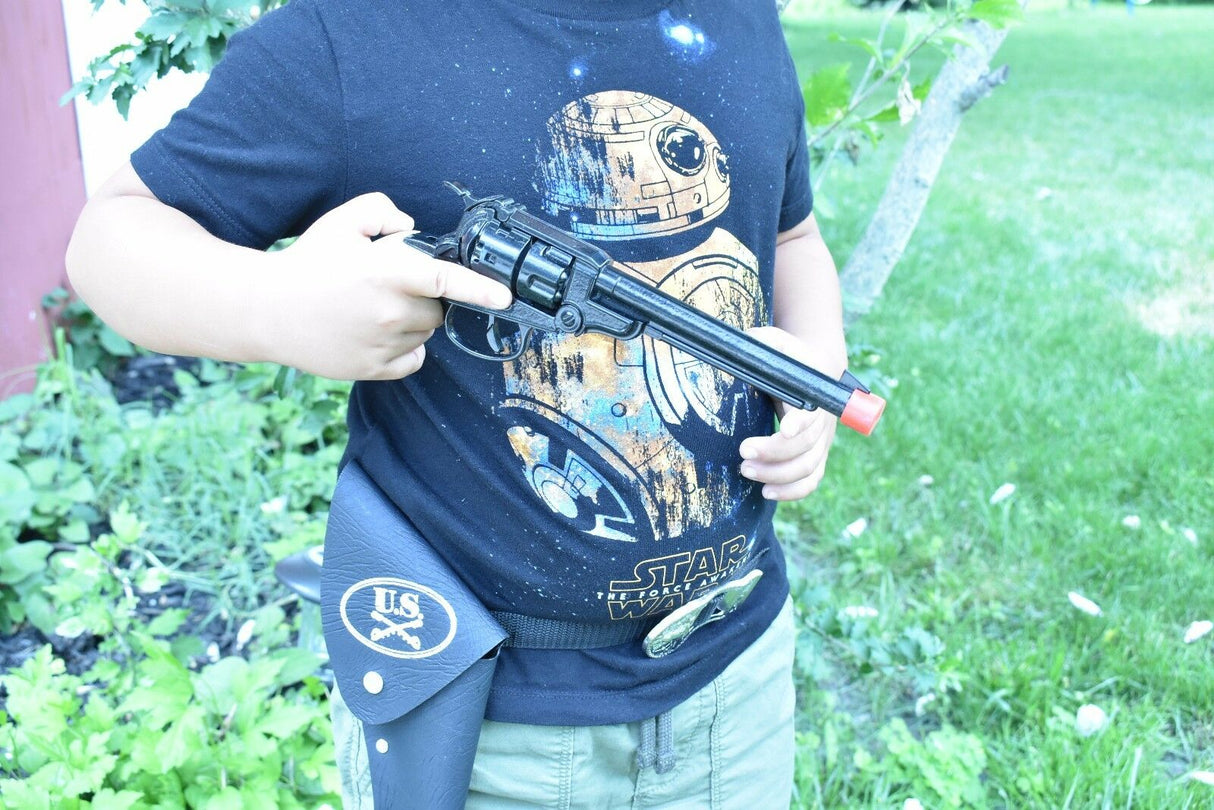 Man holding a toy revolver with a holster on his hip for Parris Toys 0652