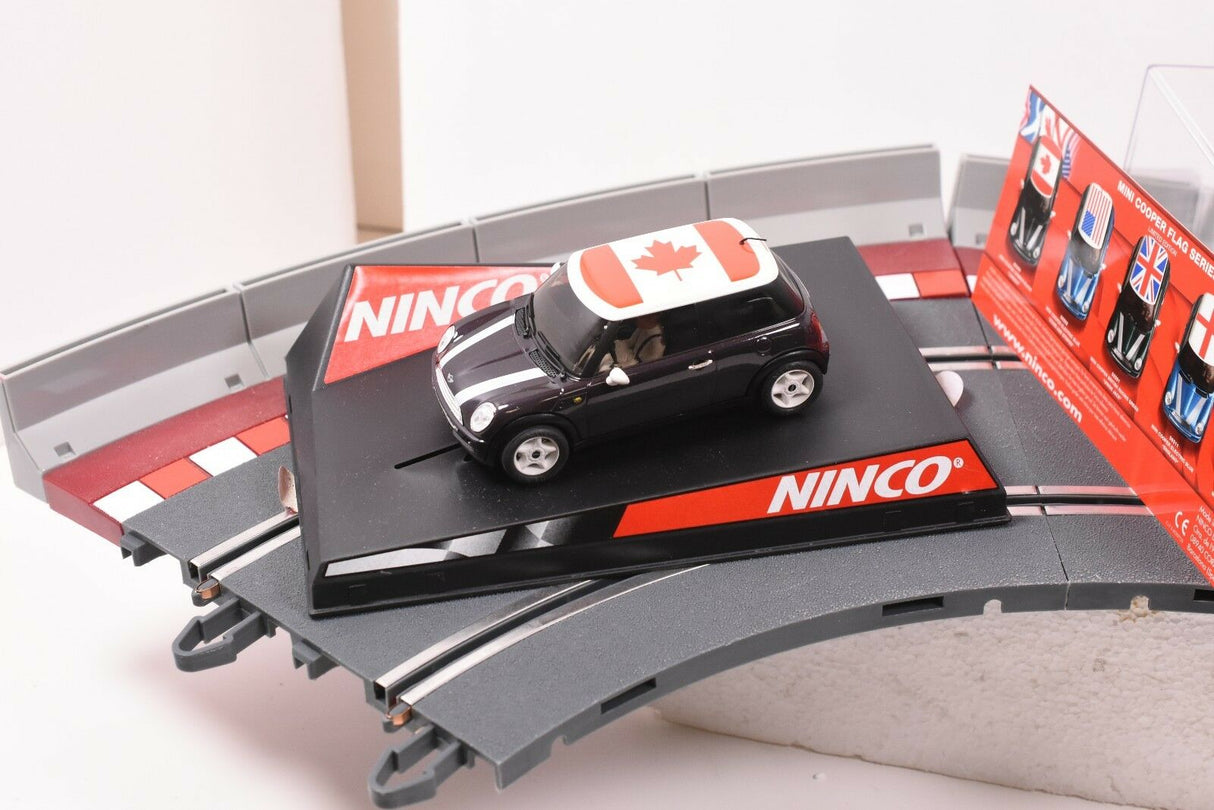 Black mini car with Canadian flag on a track set for REH Ninco 50309