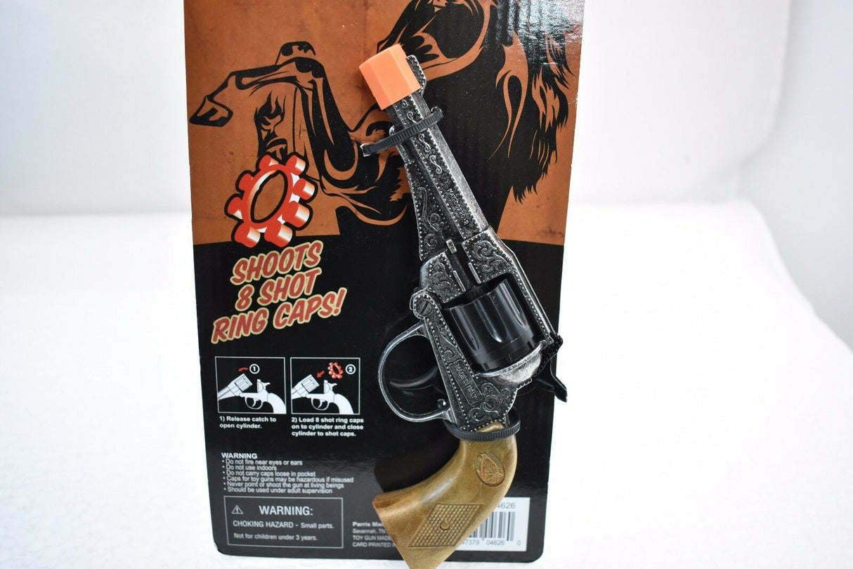 Black toy revolver with brown cardboard packaging showing shooting capacity for Parris Toys 4626