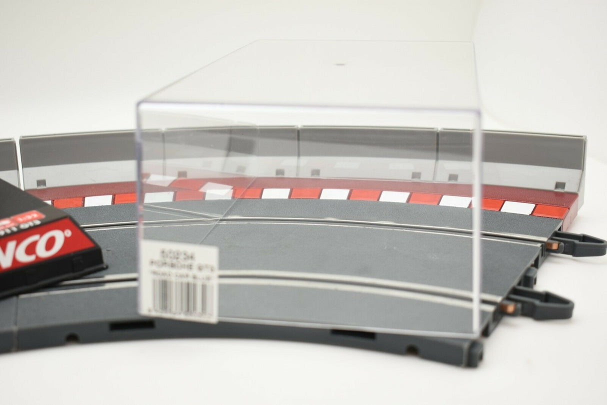 Clear acrylic display case over a section of gray and red track for NINCO 50234