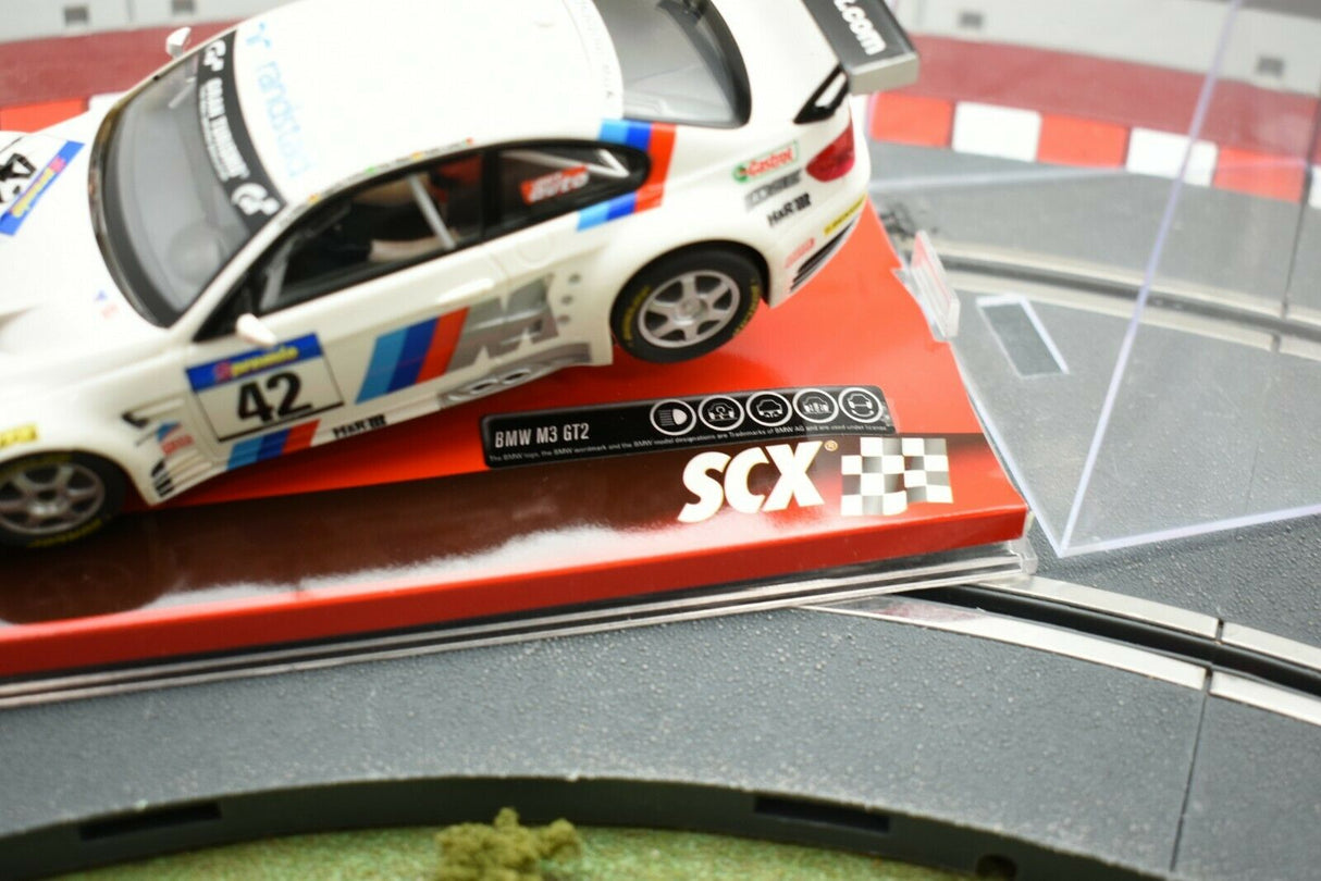 White race car model on a track section with SCX logo for A10156X3U0