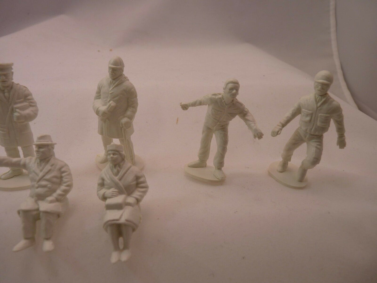 Unpainted plastic figures of motor racing track spectators and officials for AIRFIX
