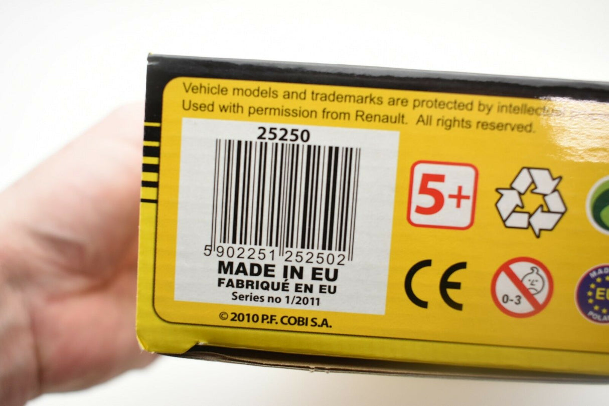 Product box showing barcode, "MADE IN EU," and safety symbols for a model car for COBI COBI2010
