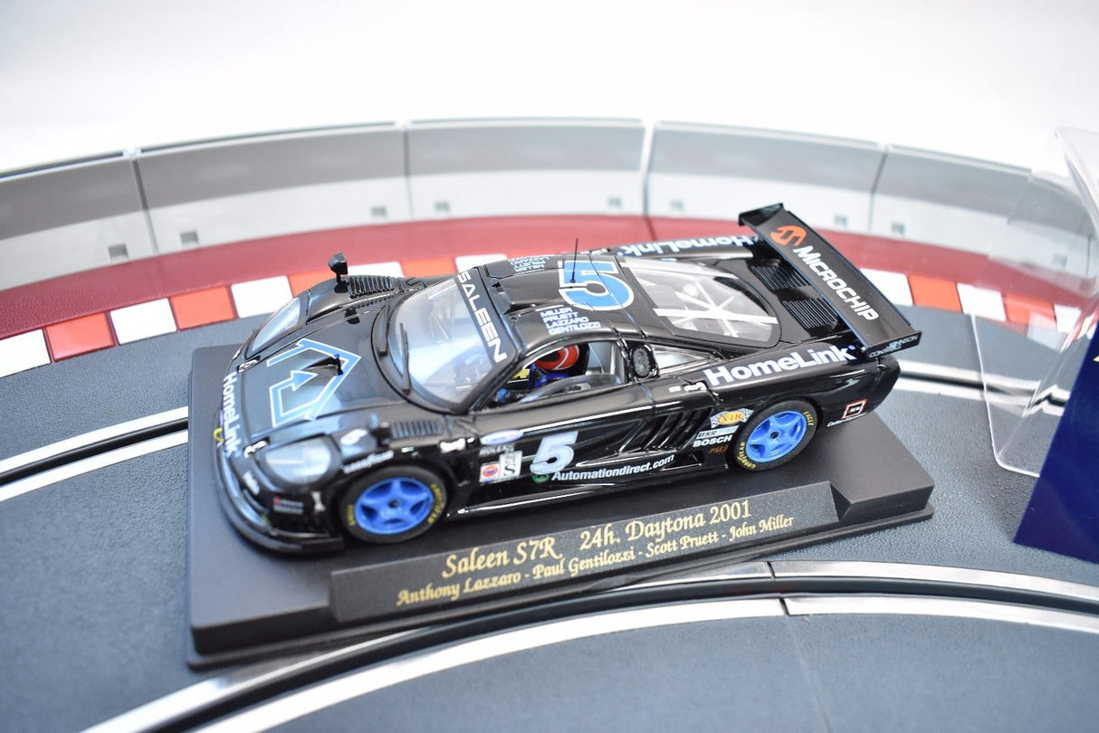 Slot car of a 2001 Saleen S7R race car on a track display for Fly Car 88015
