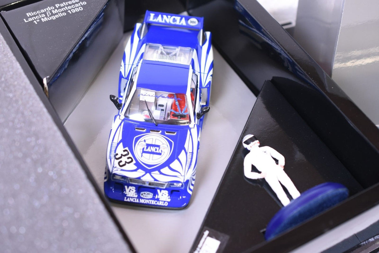 Blue Lancia Montecarlo slot car with driver figure in box for Fly Car 96011