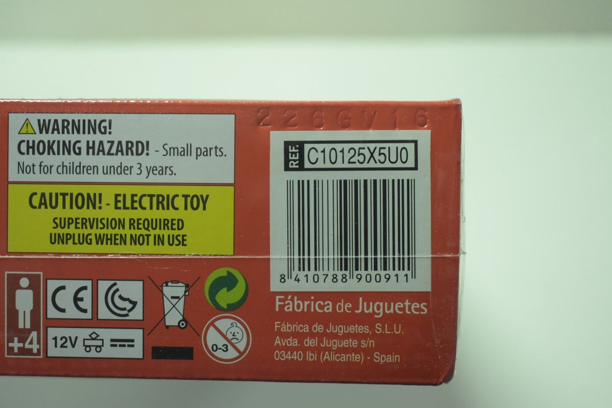 Toy box with safety warnings and product details for a ride-on toy for SCX Compact C10125X5U0