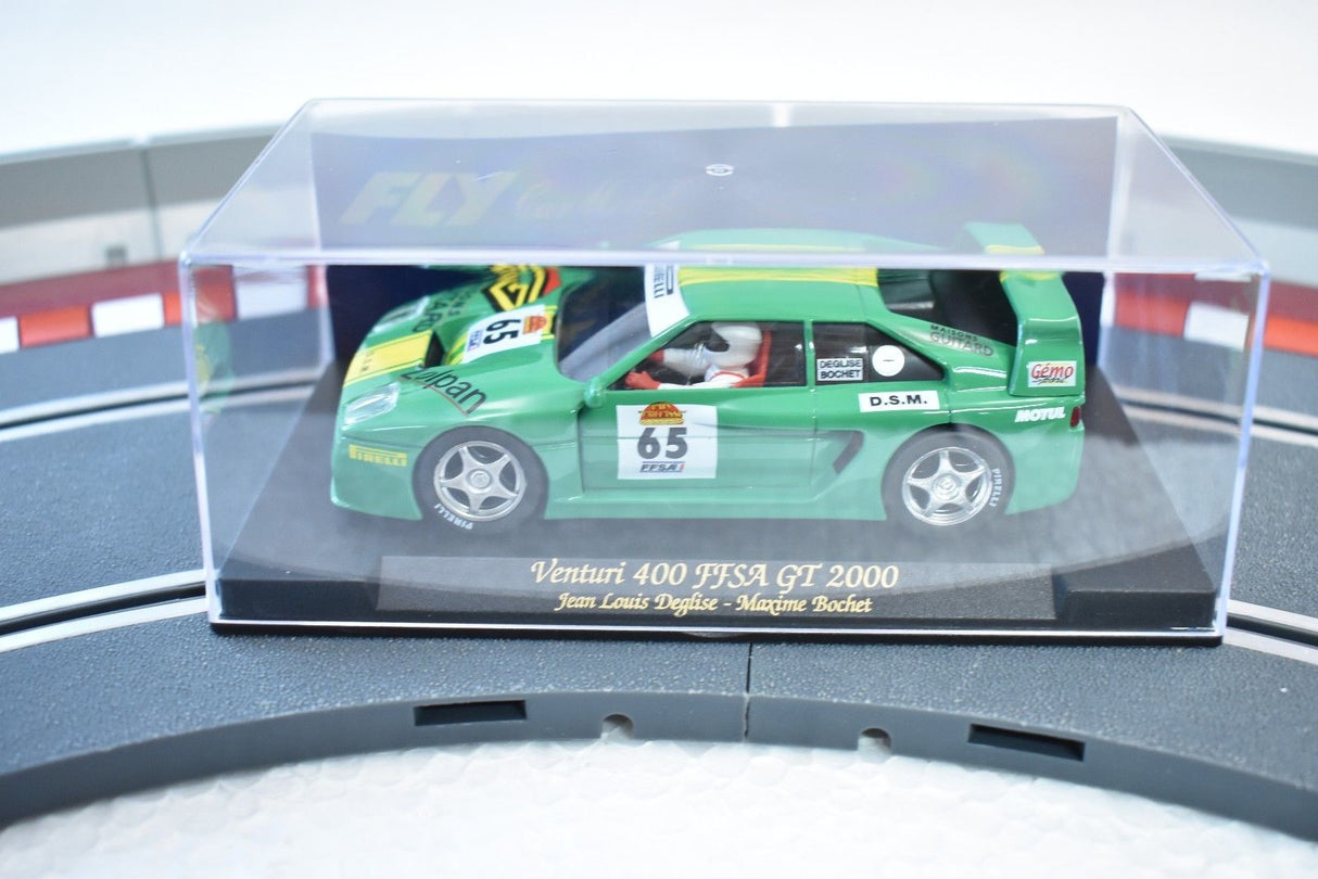 Green race car model, Venturi 400 FFSA GT 2000, displayed in a clear case for REH Fly A241