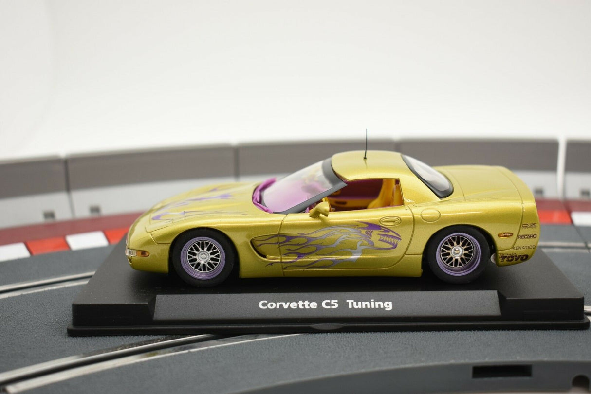 Yellow Corvette C5 model car on a display base for Fly Car 07052