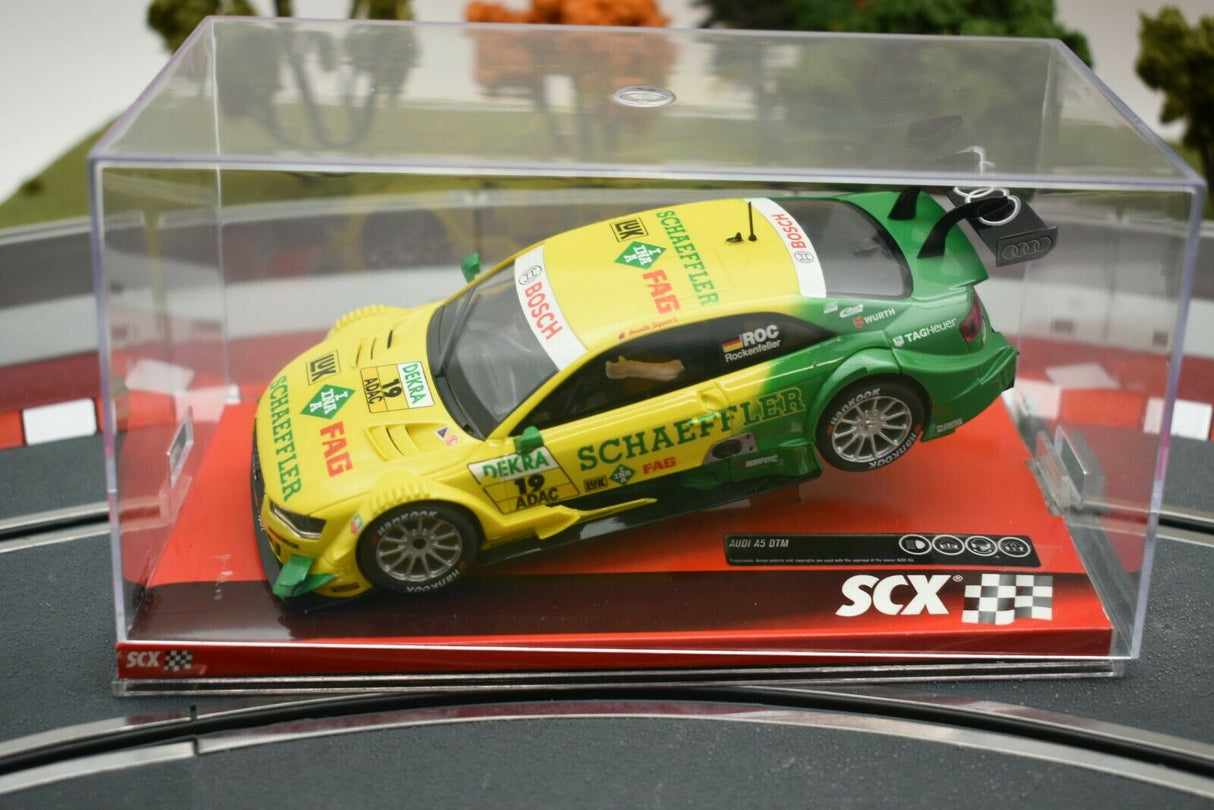 Yellow and green Audi A5 DTM race car model in a clear display case for SCX A10161X3U0