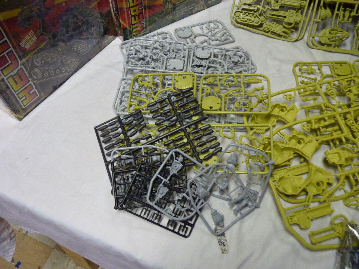 Assortment of gray and yellow plastic model building parts for IMEX 6002-6009